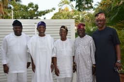 Governor Rauf Aregbesola handing over newly-elected Osun State Governor, Alhaji Gboyega Oyetola, to APC National Leader, Asiwaju Bola Tinubu, at his residence in Ikoyi Lagos on Sept. 28, 2018.