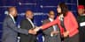 CBN Governor Godwin Emefiele exchanges greetings with the Programme Anchor at the Africa Investment Summit held Sept. 24, 2014 at the Waldorf Astoria Hotel, New York, USA. With them (L-R) are Zenith Bank Chairman Jim Ovia; Trade & Investment Minister Olusegun Aganga; and Aviation Minister Osita Chidoka.