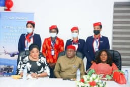 Managing Director/CEO Fidelity Bank PLC, Mrs. Nneka Onyeali-Ikpe with the Chairman, Air Peace Airlines, Mr. Allen Onyeama, and air hostesses, at the welcome ceremony and water salute for the new Embraer aircraft of Air Peace at the Nnamdi Azikiwe Airport, Abuja, on Thursday June 17, 2021.