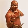 Photo shows Mike Okri barechest.