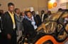 L- R: Eloghosa Iyamu, a student of the University of Benin, former Adviser to the President on Petroleum, Dr Emmanuel Egbogah inspecting a car built by students of the institution for the Shell Eco-marathon competition at the 2015 conference and exhibition of the Society of Engineers in Lagos.