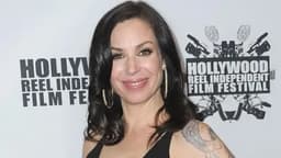 Author shot by police after backyard stand-off