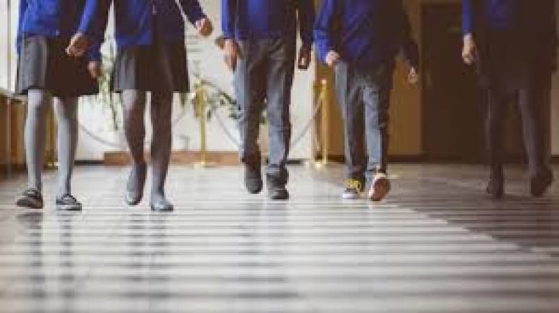 Parents protest as British school imposes hour-long detentions for pupils talking in corridors between lessons