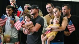 First group of white South Africans lands in US under Trump refugee plan