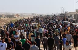 Chaos erupts on first day of US-backed aid distribution in Gaza after weeks of hunger