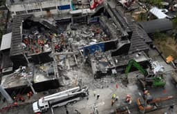 Owners of collapsed nightclub arrested for death of 236