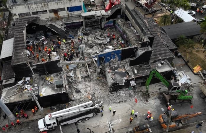 Owners of collapsed nightclub arrested for death of 236