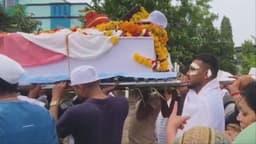 Lone Air India survivor carries coffin of brother killed in crash