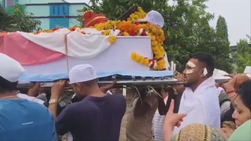 Lone Air India survivor carries coffin of brother killed in crash