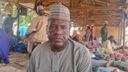 Nigerian professor who grows and sells vegetables in village market opens up