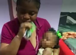 Police investigate viral video of woman feeding baby ‘Action Bitters’