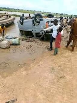 Many killed as commercial bus plunges into river while attempting to cross collapsed bridge