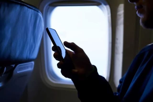 Why airlines enforce phone use rules for passengers — Expert
