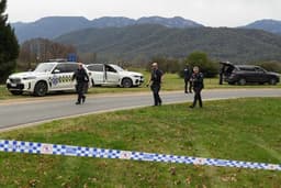 Manhunt under way after two police officers shot dead in rural Australian town