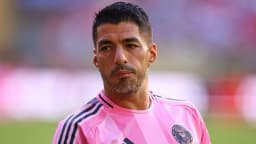 Suarez gets extra three-game ban for spitting