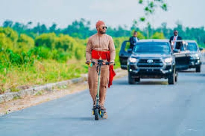 Olu of Warri rides scooter to inspect road in Delta