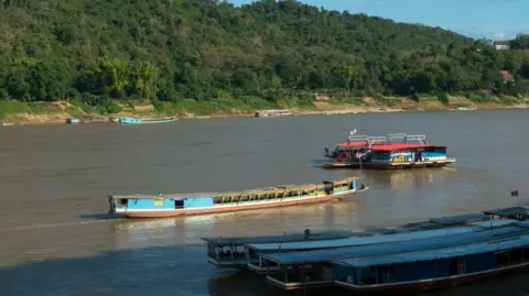Screams for help and panic as tourists rescued from fatal Laos ferry disaster