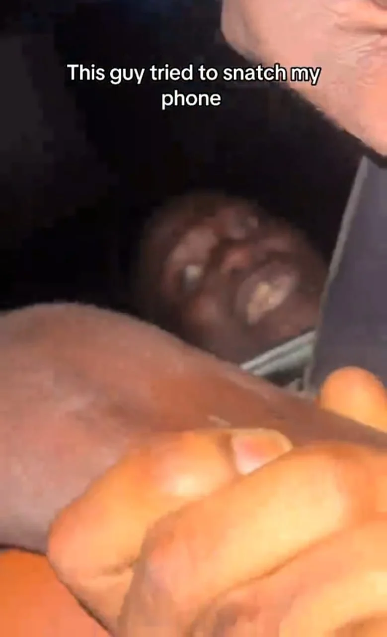 Phone snatcher left dangling after failed theft attempt in traffic