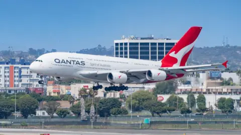 Qantas agrees to pay $74m over Covid-19 travel voucher refunds
