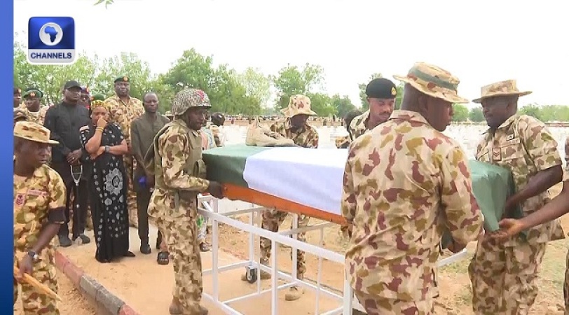 Boko Haram Attack: Slain soldier’s wife faints during burial, another weeps as her children ask, ‘Where is our daddy?’