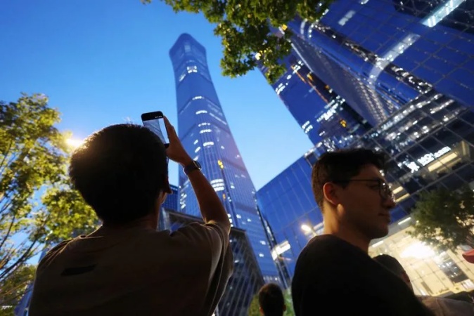 Small aircraft crashes into Beijing's tallest building