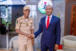 Mbah receives Immigration officer who apprehended fleeing Enugu ritual suspect