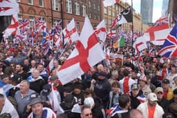 More than 100,000 join far-right rally in London, as counter-protesters demonstrate