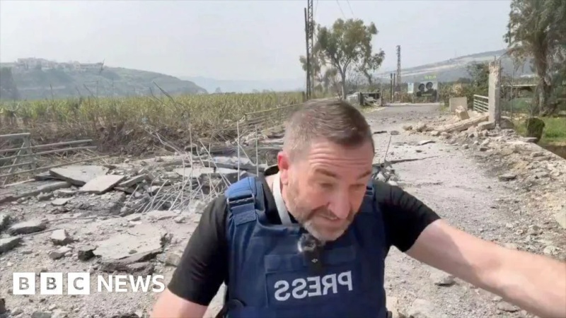 Missile lands next to presenter during live report from Lebanon