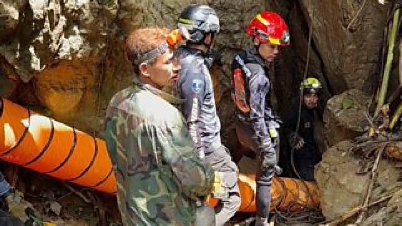 Rescuers race to free seven people trapped in flooded Laos cave